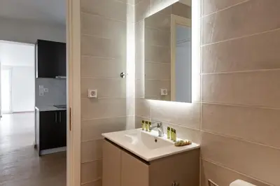 a bathroom with a sink and a mirror at Urban Athens - Two Bedroom #7 in Athens
