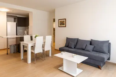 a living room with a couch and a table at Urban Athens - One Bedroom #8 in Athens