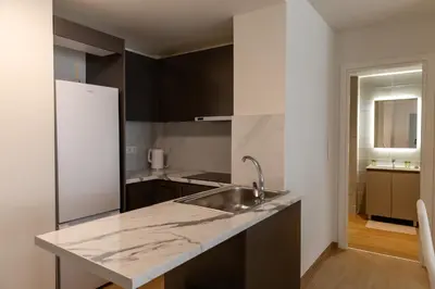 a kitchen with a sink and a refrigerator at Urban Athens - One Bedroom #8 in Athens