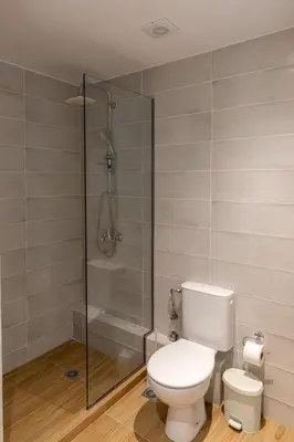 a bathroom with a toilet and a shower at Urban Athens - One Bedroom #8 in Athens