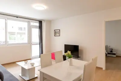 a living room with a white table and chairs at Urban Athens - One Bedroom #8 in Athens