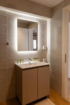 a bathroom with a sink and a mirror at Urban Athens - Two Bedroom #9 in Athens