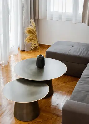 a living room with a table and a couch at Nostos Athens Luxury Residence in Athens