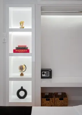 a room with white shelves and a window at Nostos Athens Luxury Residence in Athens