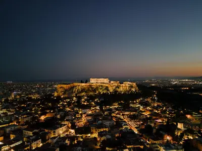 a view of a city with a building on top of a mountain at Ermou 26 Hotel in Athens