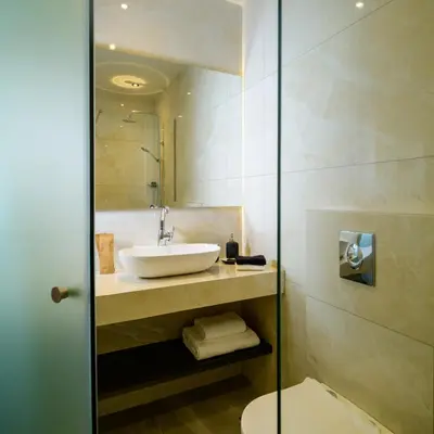 a bathroom with a sink and a toilet at Ermou 26 Hotel in Athens