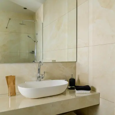 a bathroom with a sink and a glass shower at Ermou 26 Hotel in Athens
