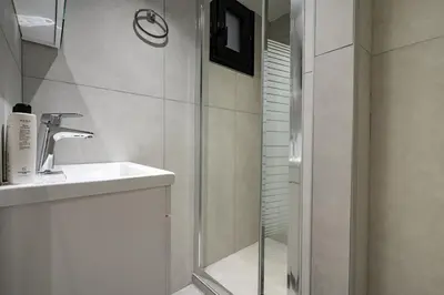 a bathroom with a shower and a sink at Athens Loftnest in Athens