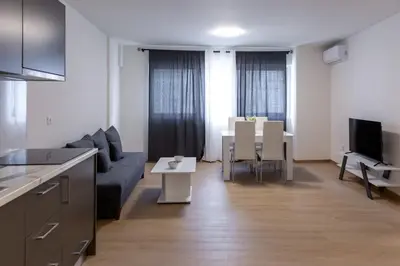 a living room with a couch and a table at Urban Athens - One Bedroom #2 in Athens