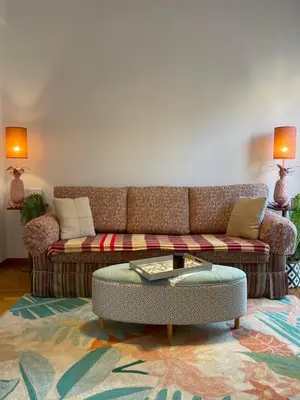 a living room with a couch and a coffee table at Colorful Apartment Close to the Acropolis in Athens