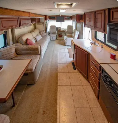 a kitchen and living room in an rv at ATHENS MOTORHOME park RV WINNEBAGO in Pallíni