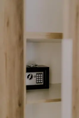 a black and white microwave sitting on a shelf at Suite Home Nikaia Metro! in Piraeus