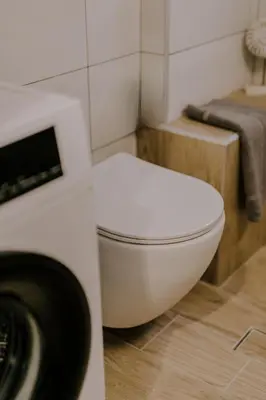 a bathroom with a white toilet in a room at Suite Home Nikaia Metro! in Piraeus