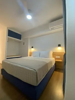 a bedroom with a large bed in a room at Living Yard Acropolis Apartments in Athens