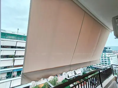 a balcony of a building with chairs at Center Athens all new and fully equipped 2 bedrooms 82 sqm big sea view apt close to Acropoli with Lift in Athens