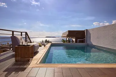 a swimming pool on the deck of a house at Casa Volare, Penthouse Retreat - Athenian Riviera in Athens