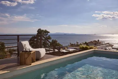 a swimming pool with a view of the water at Casa Volare, Penthouse Retreat - Athenian Riviera in Athens