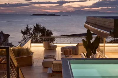 a view of the ocean from a building with a swimming pool at Casa Volare, Penthouse Retreat - Athenian Riviera in Athens