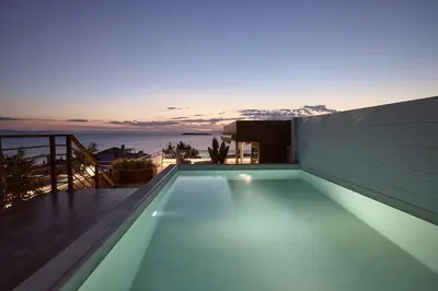 a swimming pool on the roof of a house at Casa Volare, Penthouse Retreat - Athenian Riviera in Athens