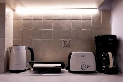 three coffeemakers sitting on a counter in a kitchen at TheJellyfishDream Sea-view Balcony Piraeus Escape in Piraeus