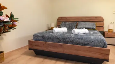 a bedroom with a bed with two pillows on it at The Athenian Nook in Athens