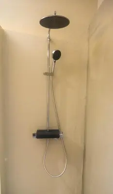 a hair dryer hanging on a wall in a room at The Athenian Nook in Athens
