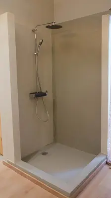 a shower in the corner of a room at The Athenian Nook in Athens