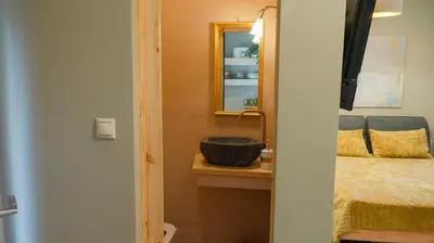 a bathroom with a sink and a mirror at The Clay Nest in Athens