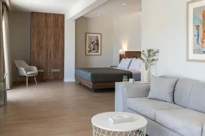 a living room with a bed and a couch at Gallery Port Tower Piraeus in Piraeus