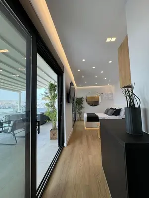 a bedroom with a bed and a view of the ocean at BlueMotion - Cruisenest Transportation included in Piraeus