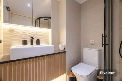 a bathroom with a sink and a toilet at Little Paradise in Athens with a Church View in Athens