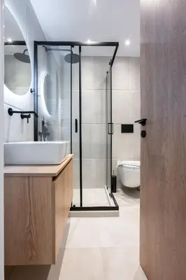 a bathroom with a shower and a sink and a toilet at Stylish 2BR flat near hospital & Panormou metro in Athens