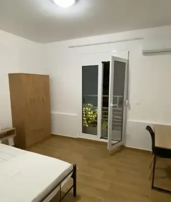 a white room with a bed and two windows at studio room with private bathroom-floor 2 in Athens