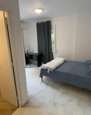 a bedroom with a bed and a desk in a room at studio room with private bathroom-floor 2 in Athens