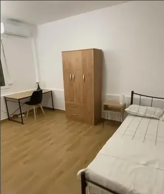 a bedroom with a desk and a bed and a cabinet at studio room with private bathroom-floor 2 in Athens