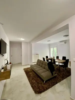 a living room with a couch and a table at studio room with private bathroom-floor 2 in Athens