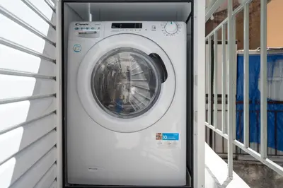 a washing machine in a door of a house at Spacious Luxury Apartment Near Piraeus Port in Piraeus
