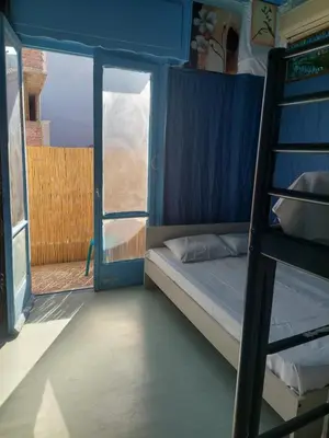 a bedroom with a bunk bed and a open door at SHARING ROOM IN NEAR THISSIO METRO STATION BY ACROPOLIs in Athens