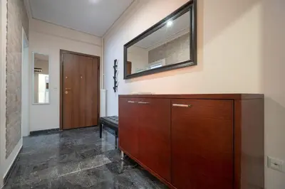 a room with a dresser and a mirror on the wall at Athens Vibe Apartment - Gazi by ΜΡS in Athens