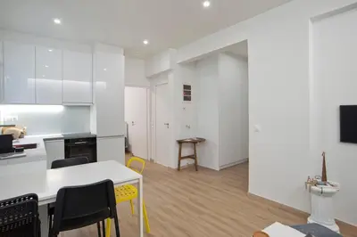 a kitchen and dining room with a table and chairs at Aether Athens Luxurious Fully Renovated Apt in Athens