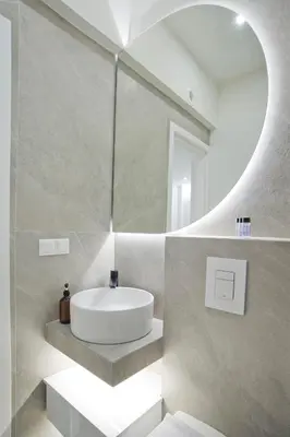 a bathroom with a white sink and a mirror at Aether Athens Luxurious Fully Renovated Apt in Athens