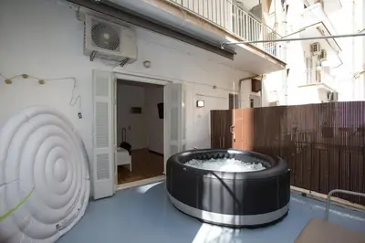 a hot tub in the middle of a building at Athens Central Jacuzzi Retreat in Athens