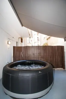 a large hot tub in the middle of a building at Athens Central Jacuzzi Retreat in Athens