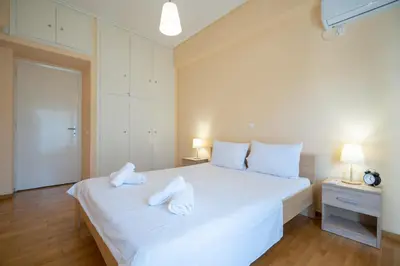 a bedroom with a large white bed with two pillows at Urban Nest In Chalandri by MΡS in Athens