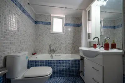 a bathroom with a tub and a toilet and a sink at Urban Nest In Chalandri by MΡS in Athens