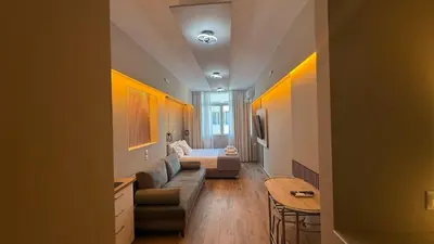 a living room with a couch and a bed at Monastiraki 303 SuperHost Hub in Athens