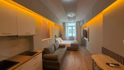 a living room with a couch and a bed at Monastiraki 303 SuperHost Hub in Athens