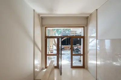 a hallway with an open door to a building at Kolonaki Luxury Studios in Athens