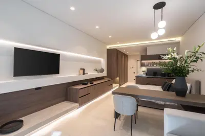 a living room with a television and a dining table at Kolonaki Luxury Studios in Athens