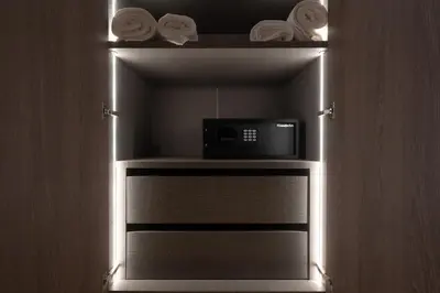 a small microwave sitting on a shelf in a room at Kolonaki Luxury Studios in Athens